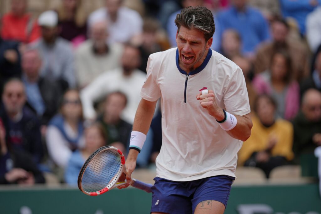 Cameron Norrie celebrates his upset victory over Daniil Medvedev at Roland Garros 2025, showcasing determination and skill.