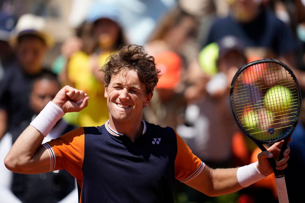 Casper Ruud struggles with injury during his French Open exit to Nuno Borges, showcasing a tense second-round match.