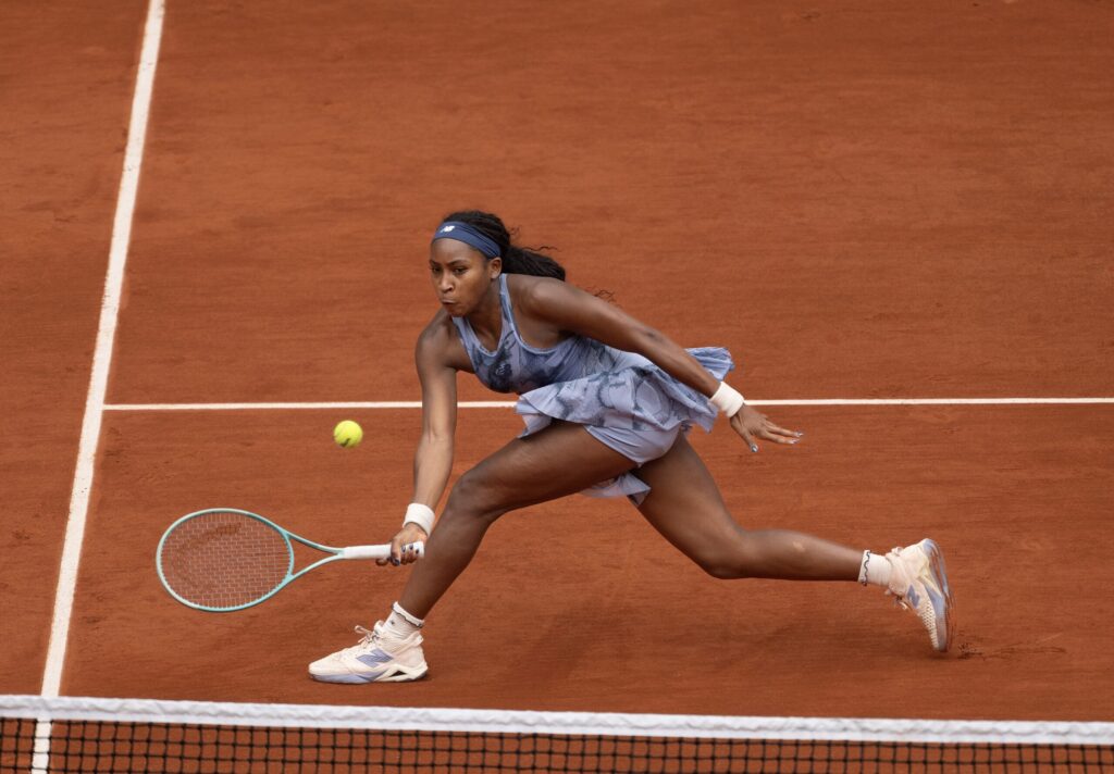 Coco Gauff celebrates her victory at the 2025 French Open, eyes set on improving her serve for the next round.