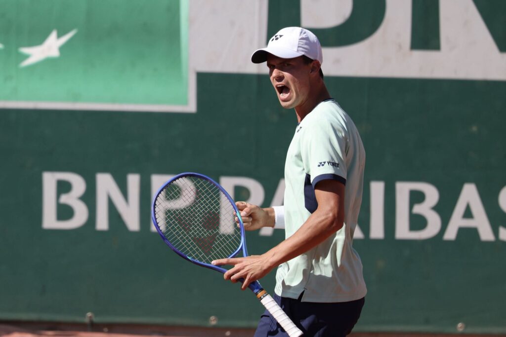 Frances Tiafoe and Daniel Altmaier prepare for their thrilling match at Roland Garros, showcasing skill and style.