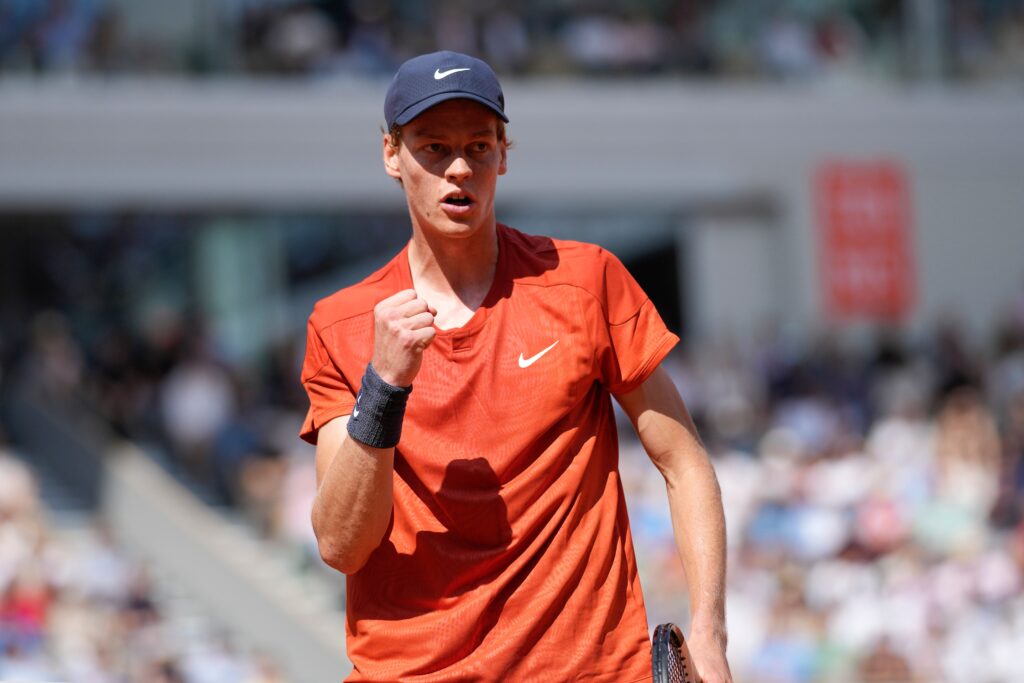 Jannik Sinner celebrates his victory over Andrey Rublev at the 2025 French Open, showcasing his dominant performance.